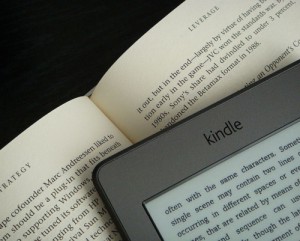 photo of kindle book against print book, writing mistakes to avoid